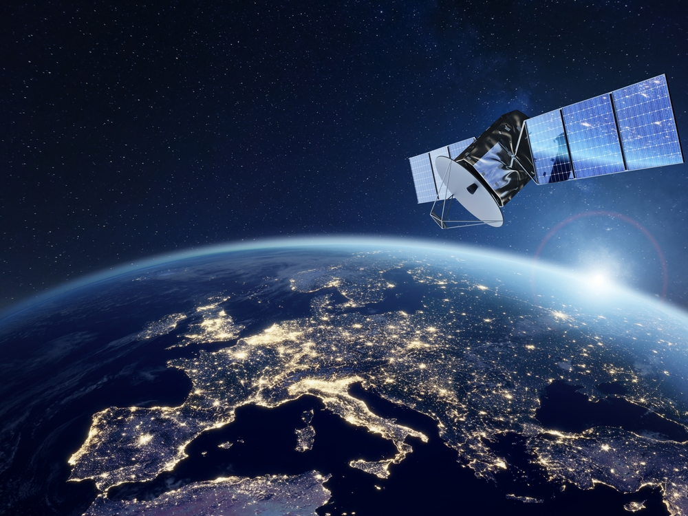 A satellite in orbit with Europe in the background